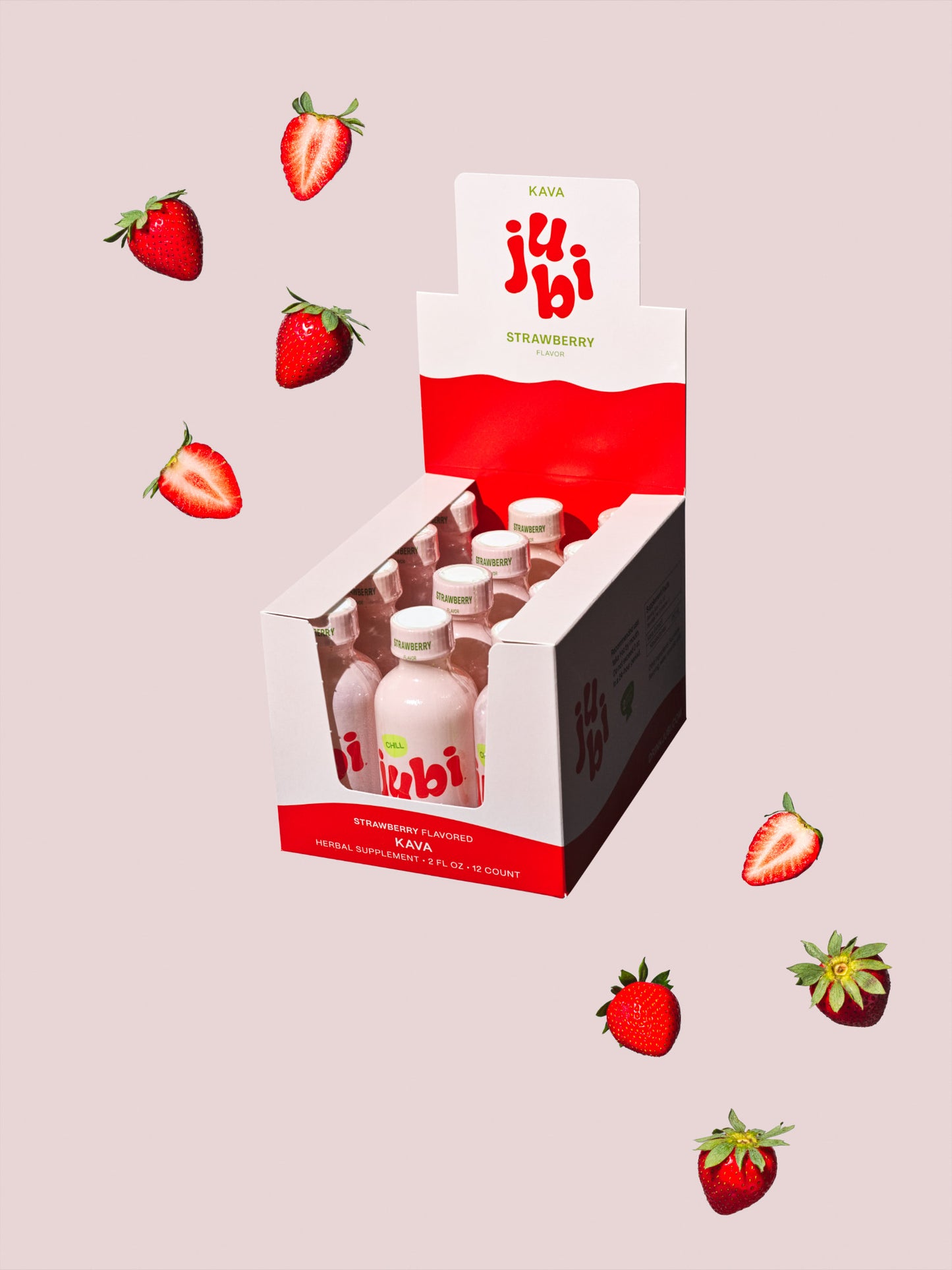 Jubi Strawberry kava shots with scattered strawberries.